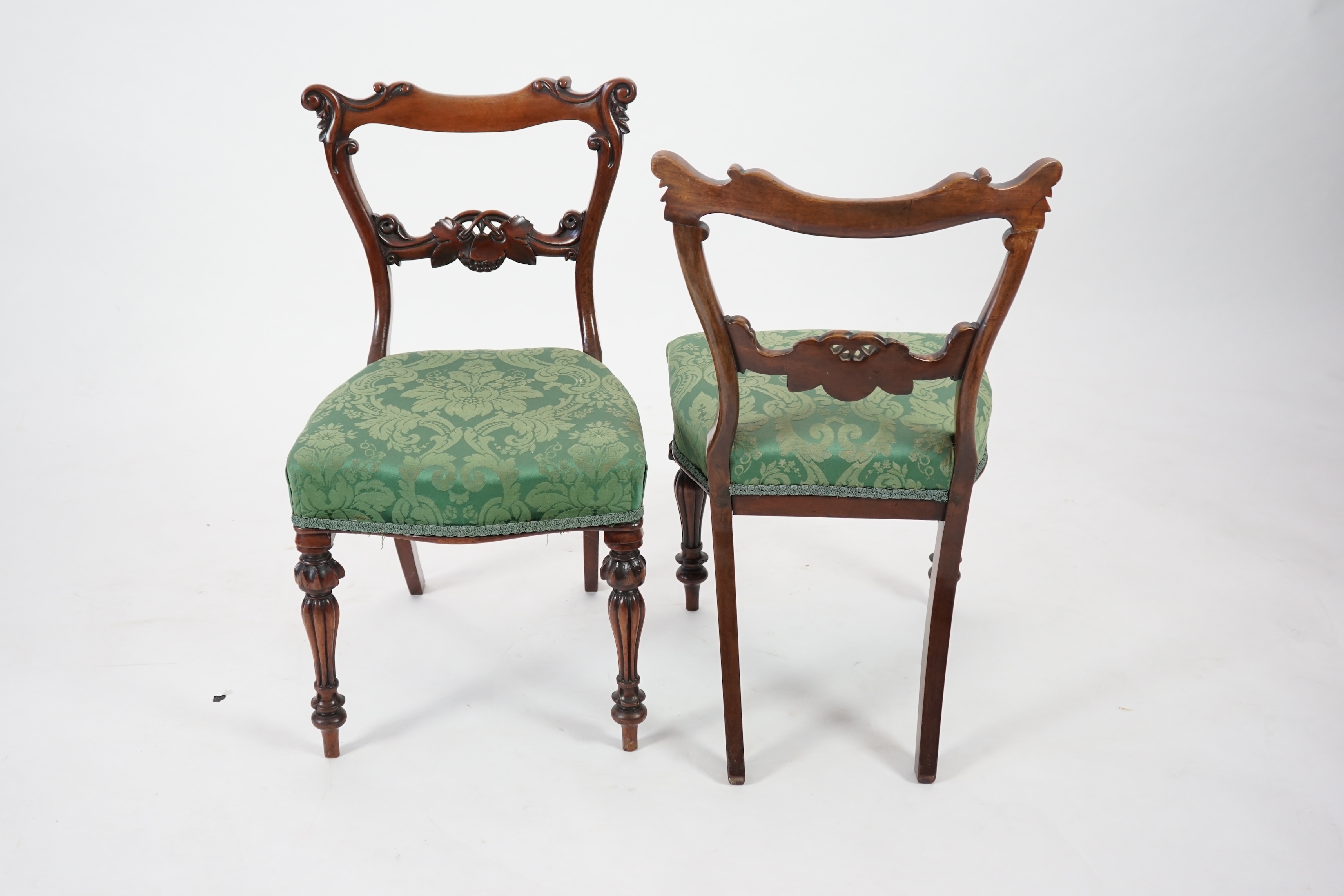 A pair early Victorian mahogany buckle back dining chairs